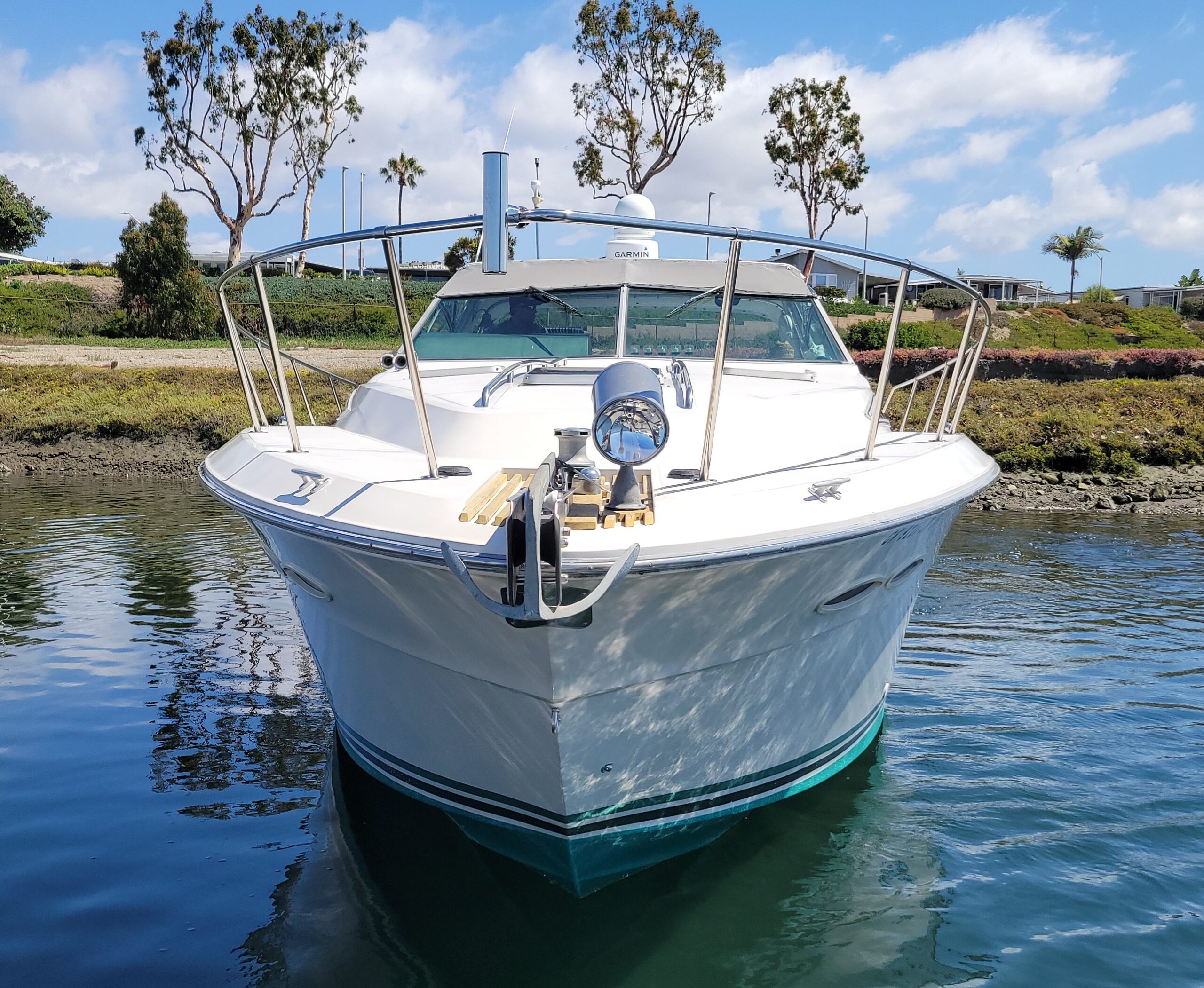 White boat docked in calm water