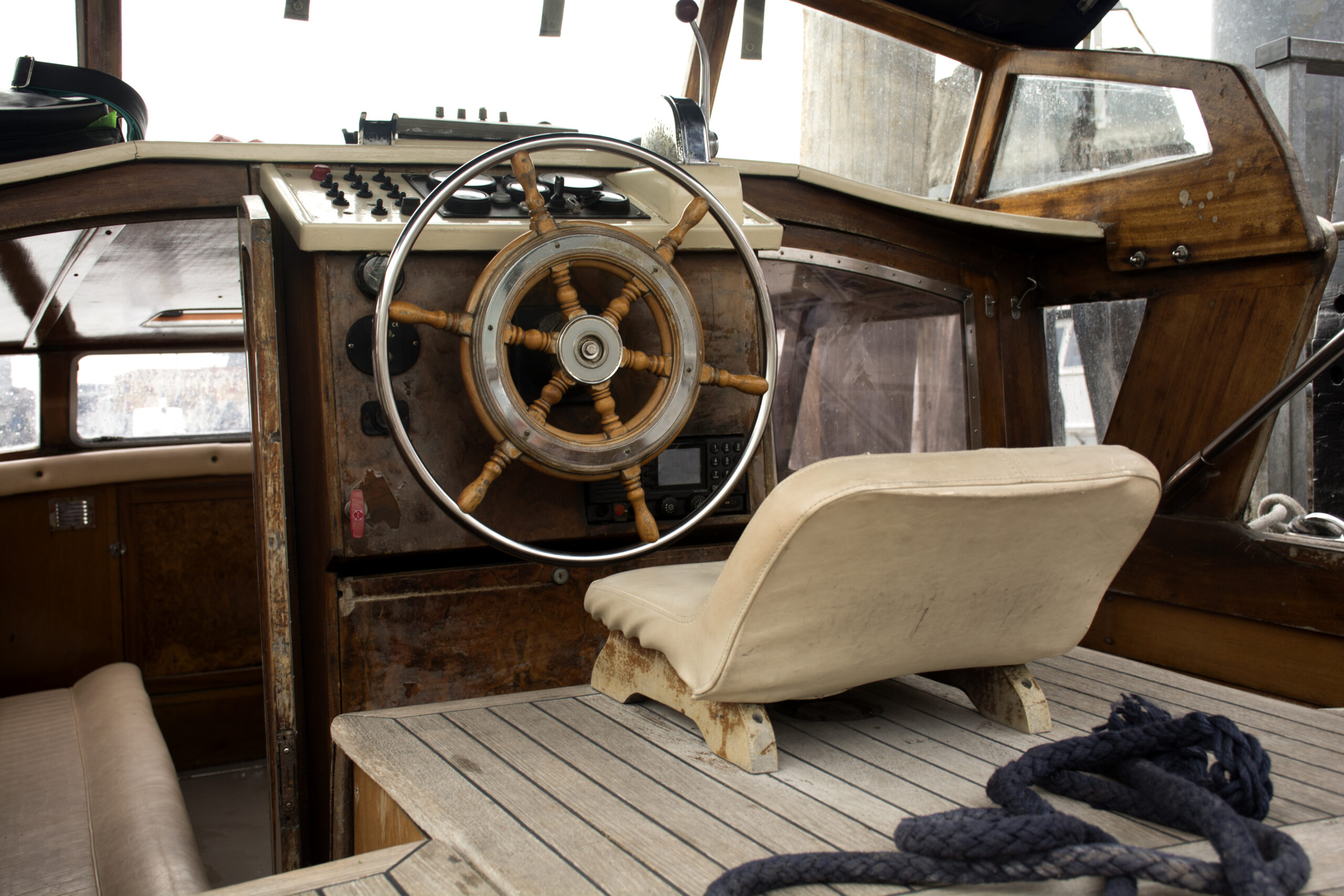 Wooden boat cockpit with helm