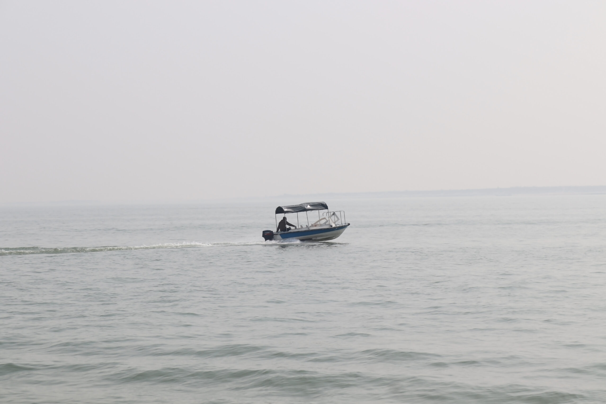 Small boat navigating open water