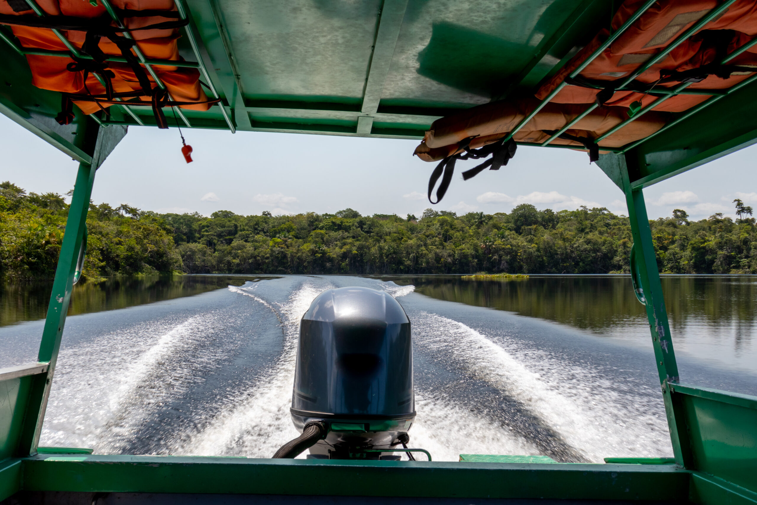 Boat cruising on a calm river