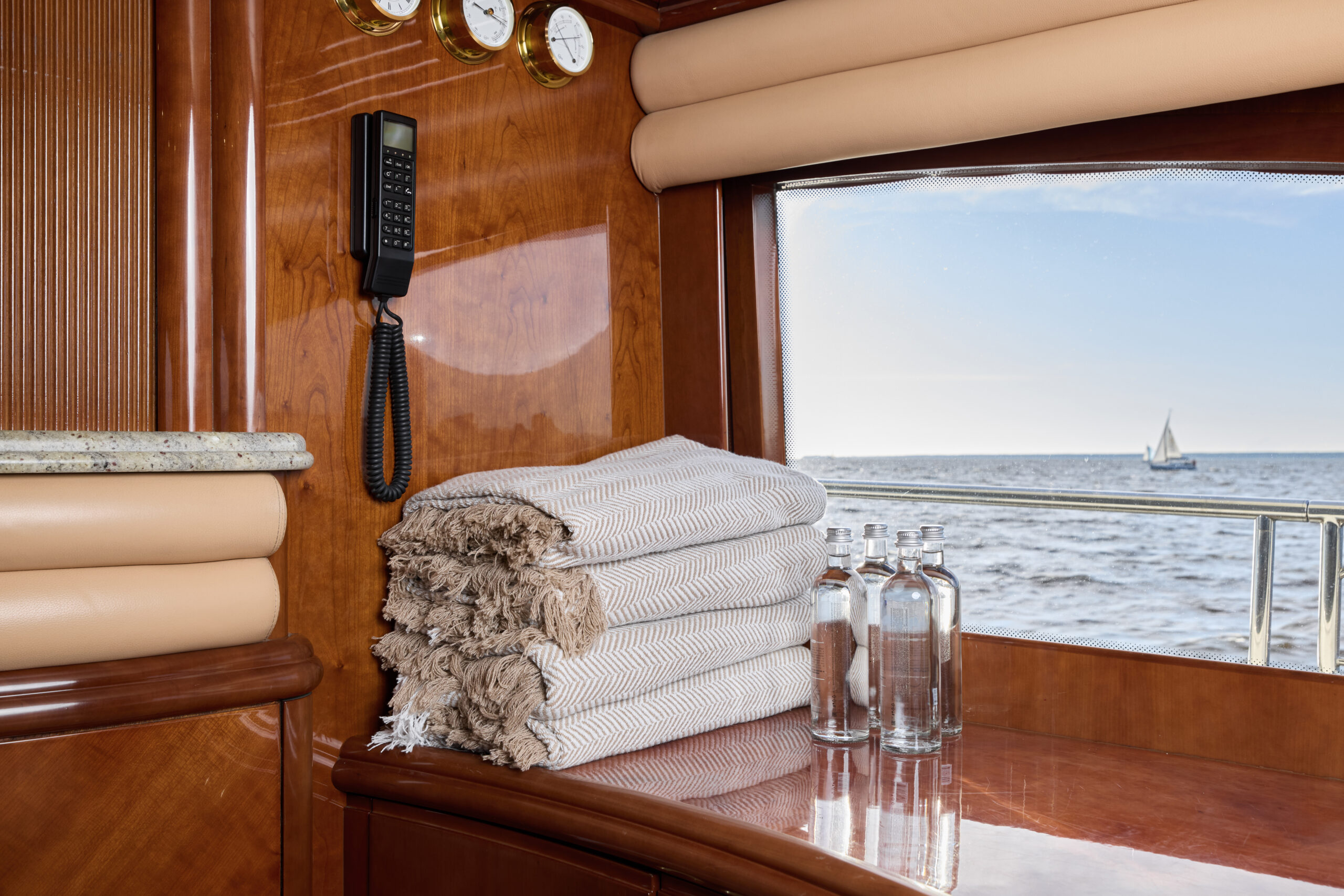 Towels and bottles on yacht table