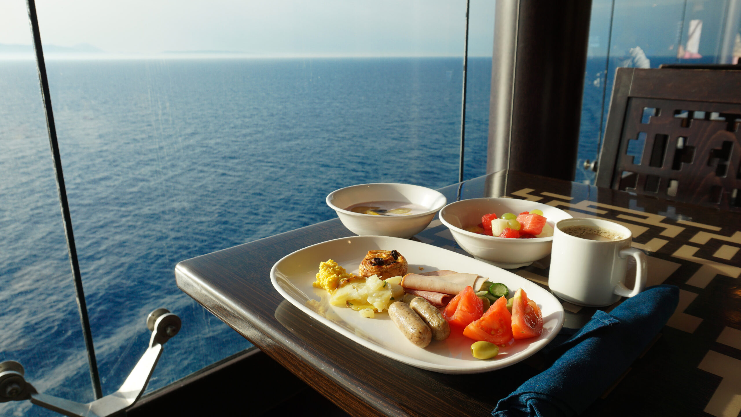 Oceanfront breakfast with fresh fruit and coffee