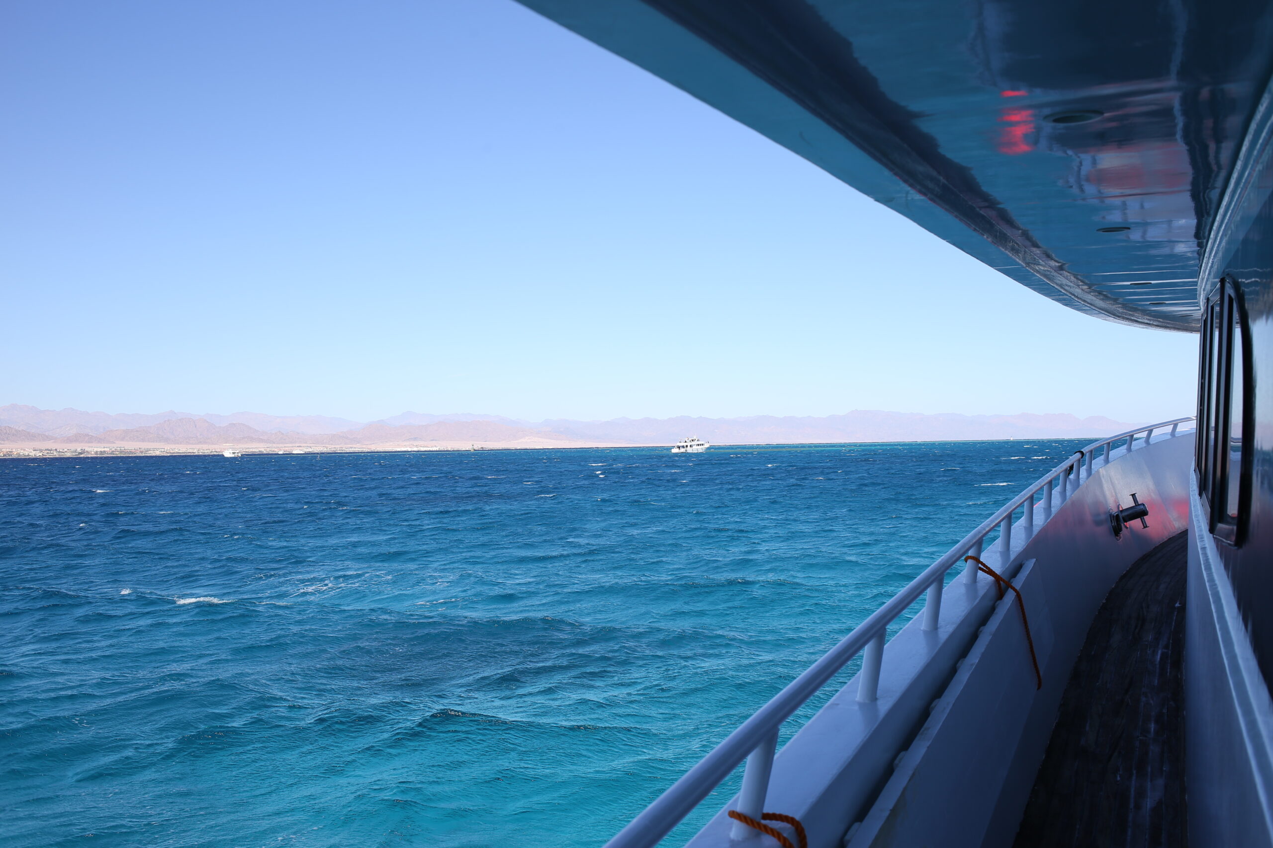 View from boat on clear blue ocean