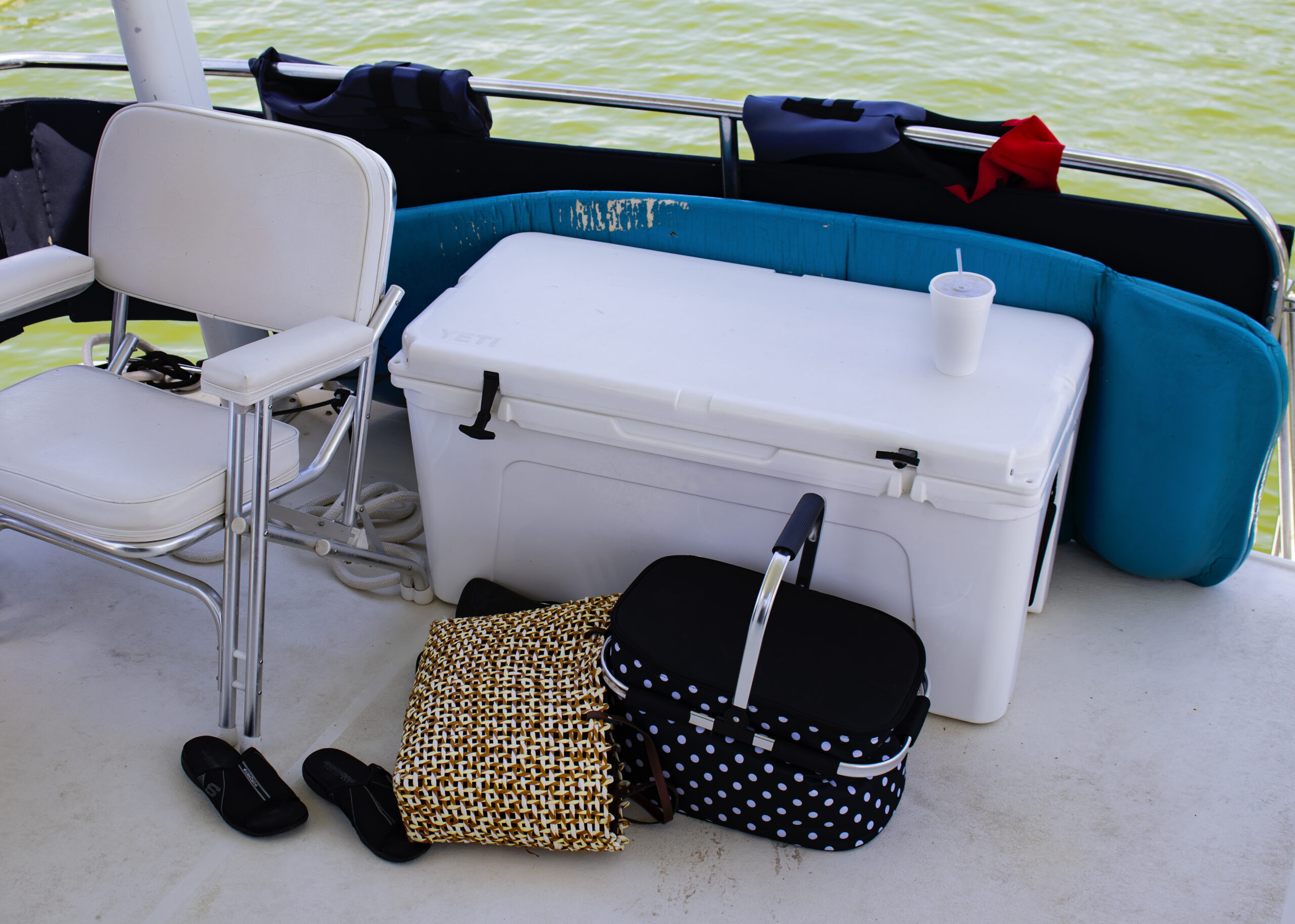 Bags and cooler on boat deck