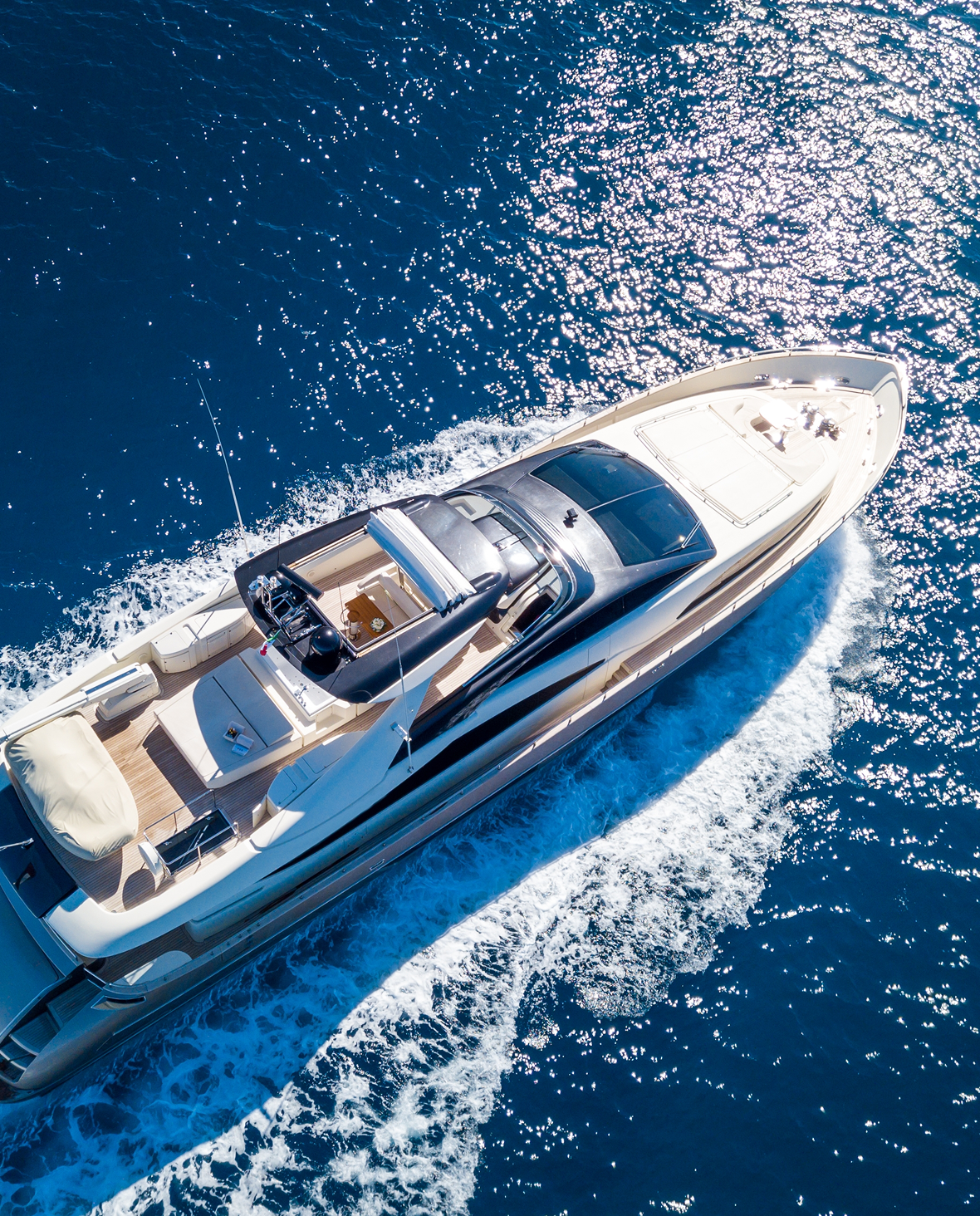 Yacht cruising through sparkling sea