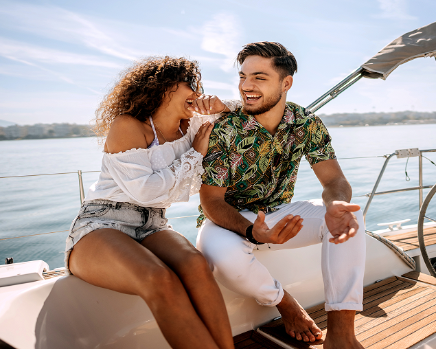 Couple laughing on a yacht