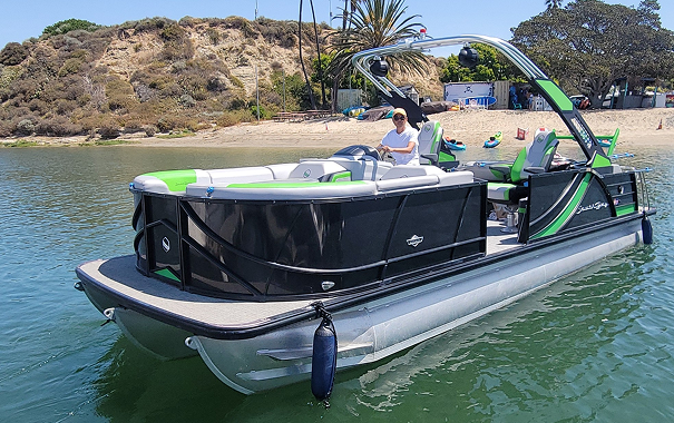 Man steering pontoon boat